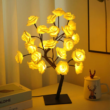 Christmas Decorative Night Light with glowing yellow roses on a decorative tree base for festive ambiance.