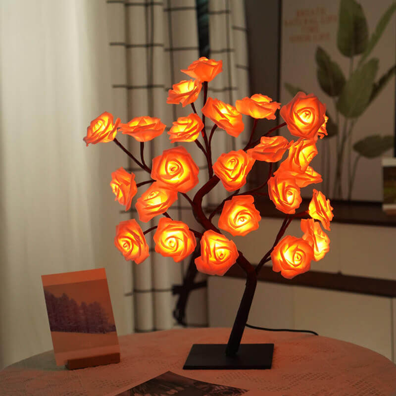 Christmas Decorative Night Light in the shape of a rose tree, glowing warmly in a cozy room setting.