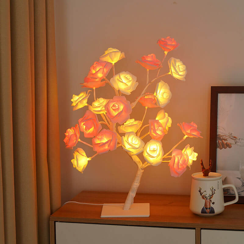 Christmas Decorative Night Light illuminating a charming rose lamp on a wooden table with a cozy atmosphere.